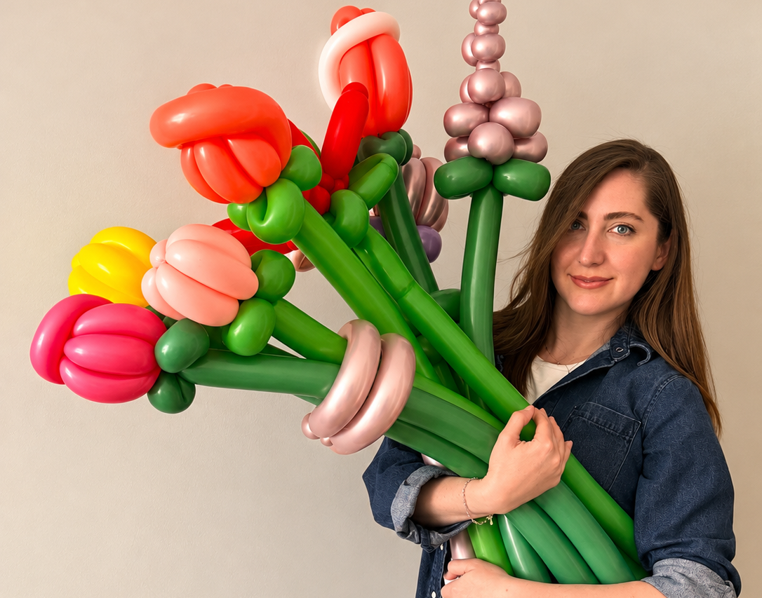 Professional balloon twisting artist creating colorful balloon animals for kids’ parties and events in Toronto & the GTA by Hello Event